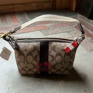 Coach signature heritage pouch